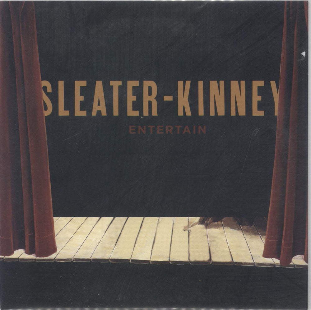 Sleater-Kinney Entertain - Red Vinyl US 7" vinyl single (7 inch record / 45) SP687